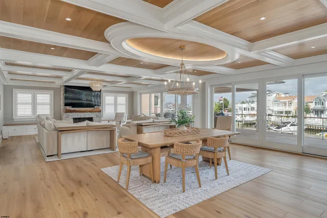 a large kitchen with a table and chairs