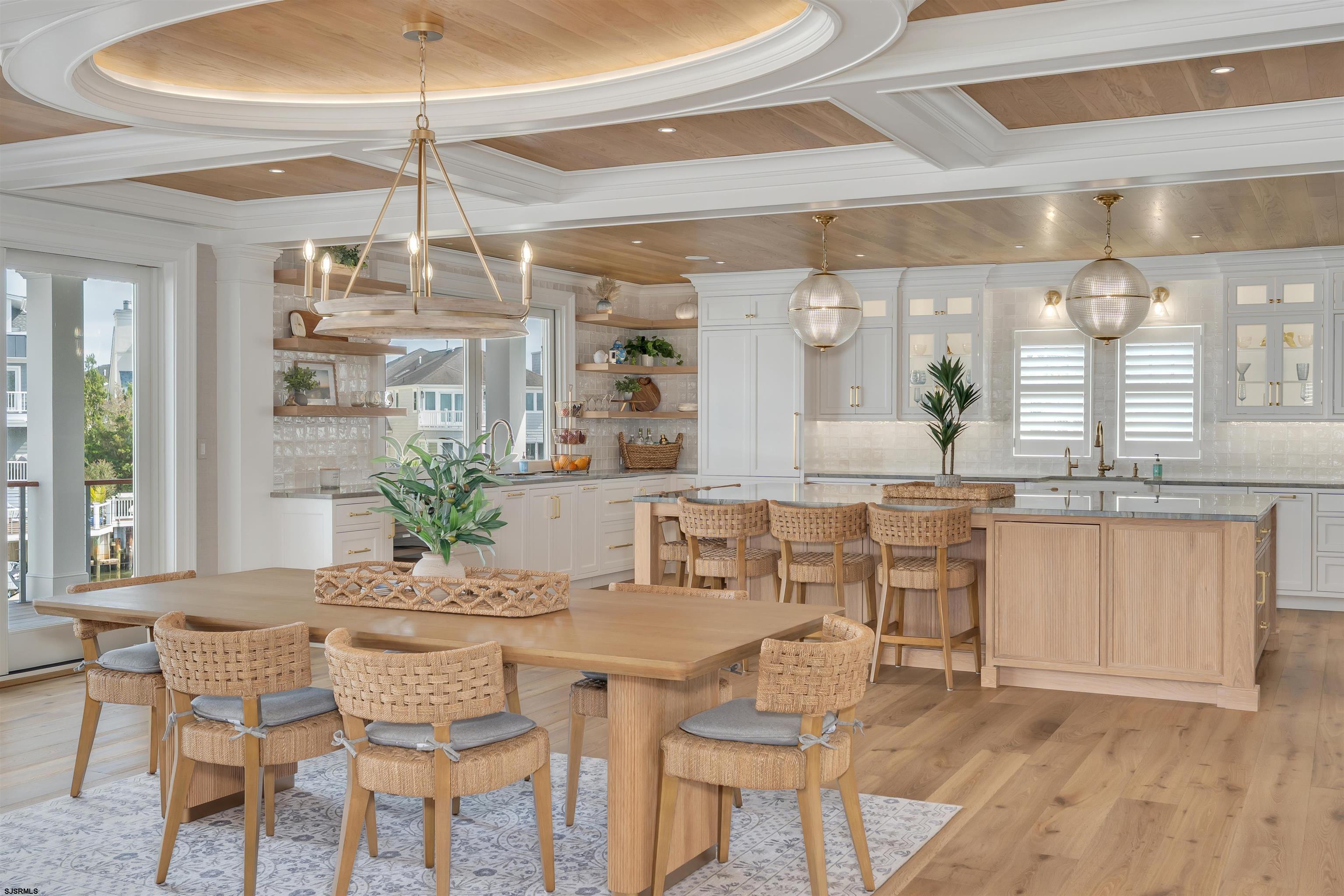 55 Walnut Road Ocean City, NJ 08226 - Photo 19 of 72 a view of a dining room with furniture wooden floor and chandelier