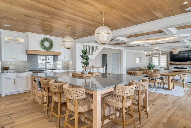a kitchen with a potted plant on the counter and cabinets