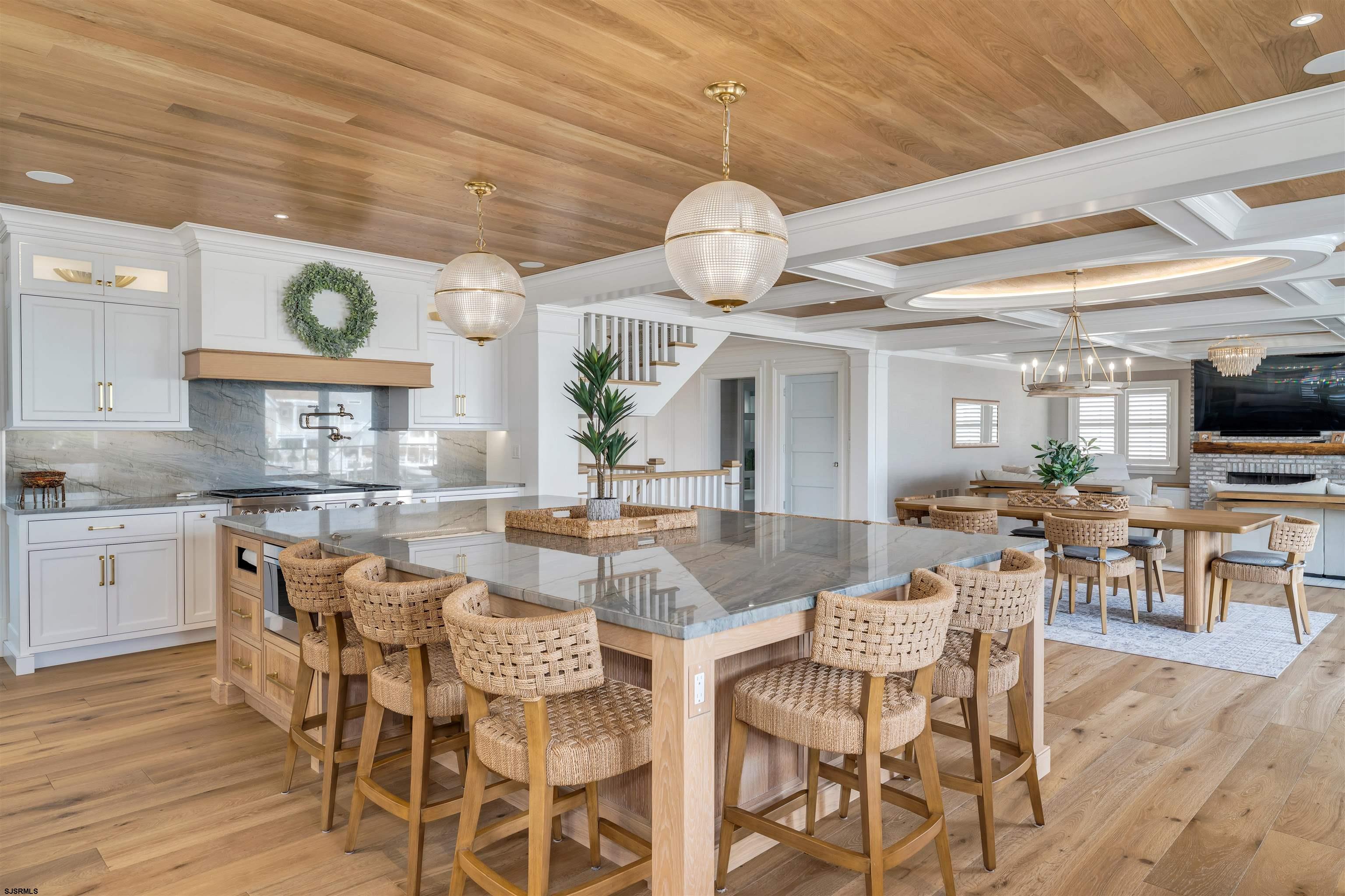 55 Walnut Road Ocean City, NJ 08226 - Photo 24 of 72 a view of a dining room with furniture a kitchen and chandelier
