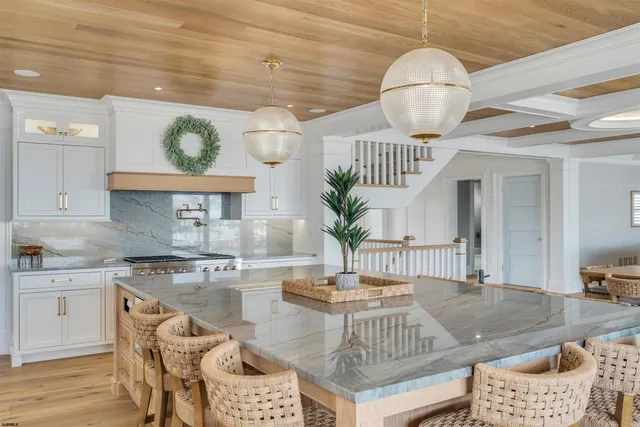 a kitchen with a table and chairs in it