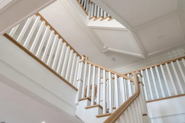 an aerial view of a house with pool and porch