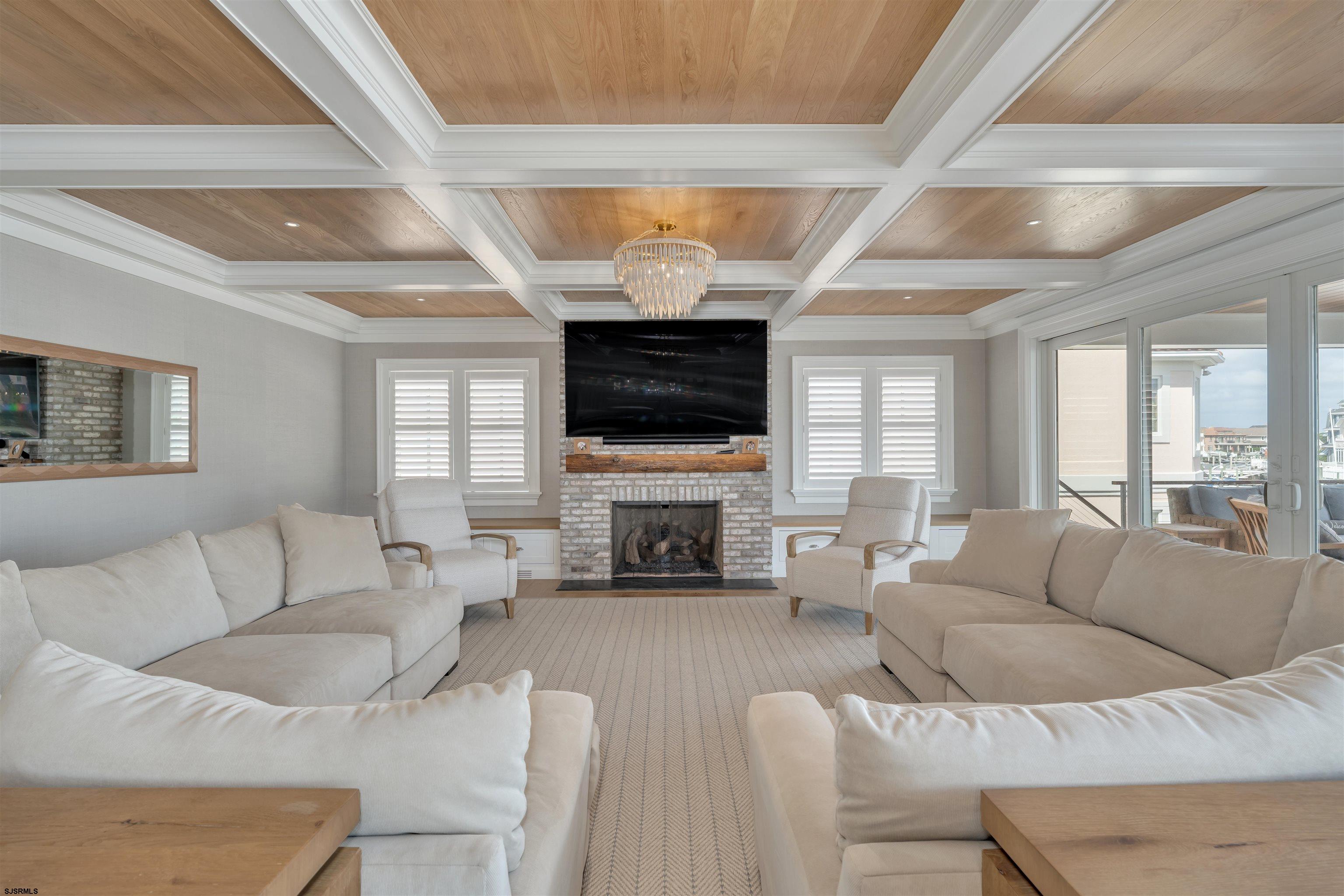 55 Walnut Road Ocean City, NJ 08226 - Photo 10 of 72 a living room with furniture a fireplace and a flat screen tv