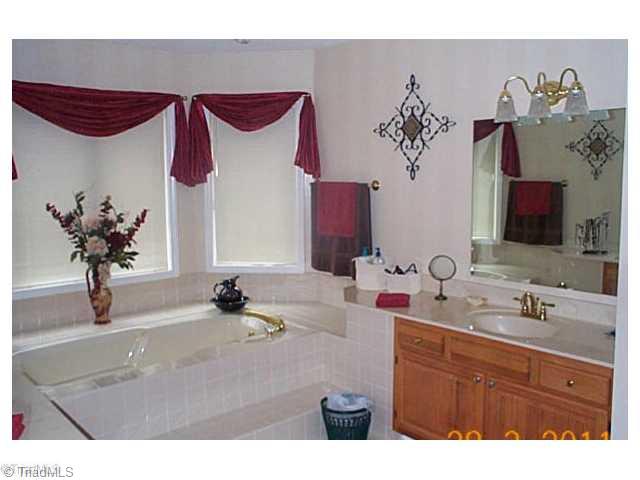 7903 Riding Trail Court Oak Ridge, NC 27310 - Photo 11 of 15 Exterior Front. Master BR BATH Jet tub, double sinks separate shower
