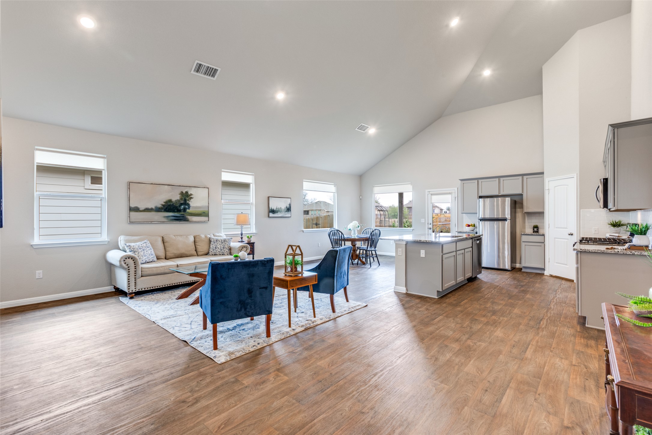 111 Rainmaker Cove Bastrop, TX 78602 - Photo 13 of 36 a living room with furniture and a wooden floor