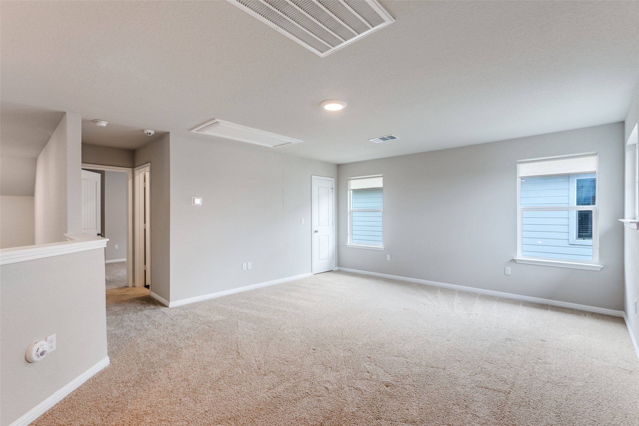 111 Rainmaker Cove Bastrop, TX 78602 - Photo 23 of 36 an empty room with windows and closet