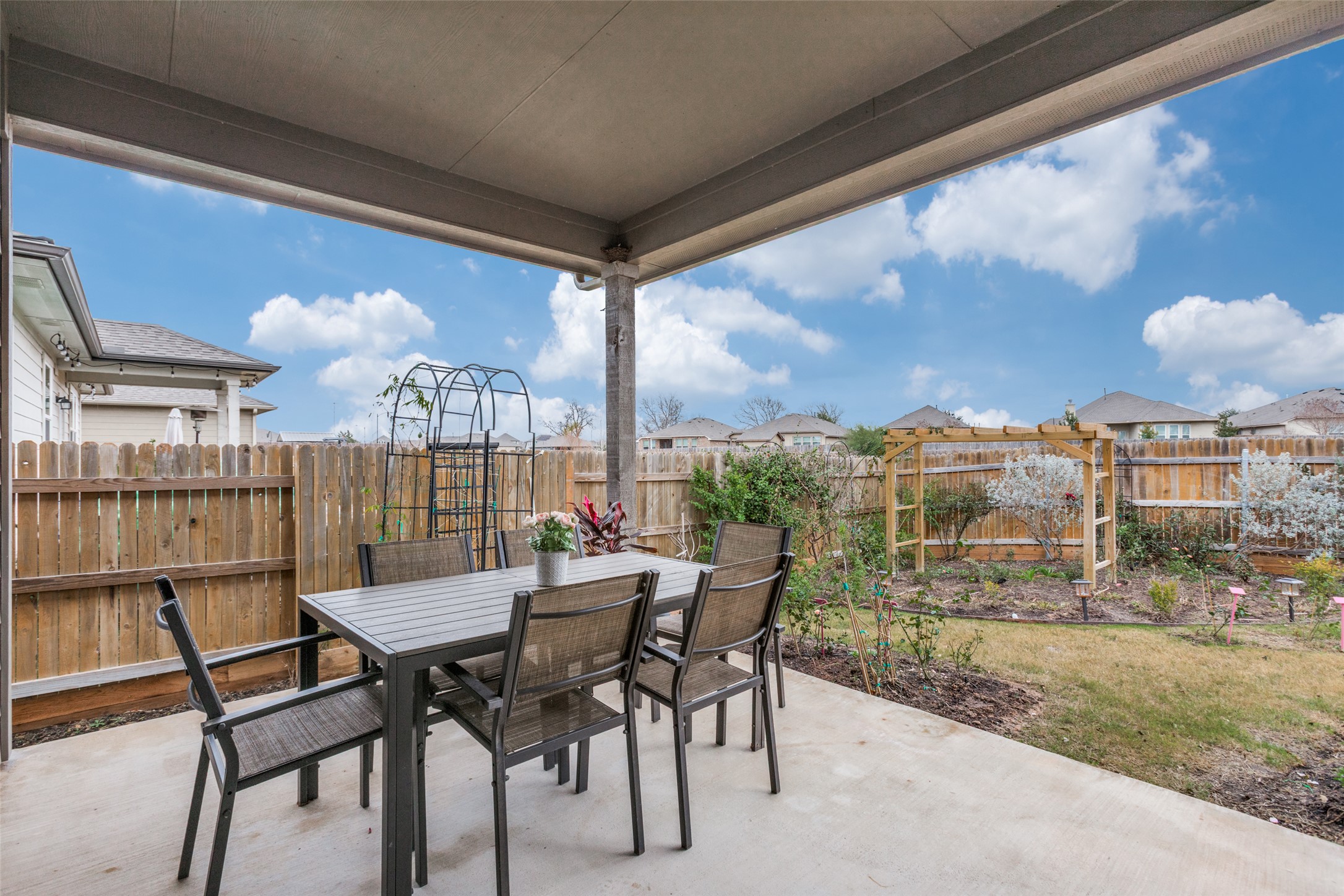 111 Rainmaker Cove Bastrop, TX 78602 - Photo 28 of 36 a view of a chairs and table in patio