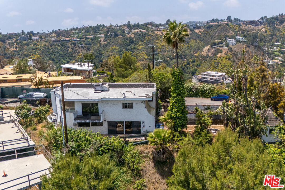 1830 Bel Air Road Los Angeles, CA 90077 - Photo 8 of 9 a aerial view of a house with a yard and lake view