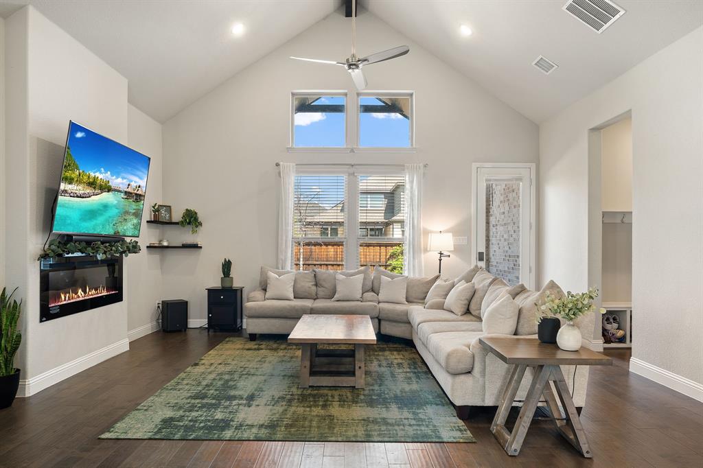 2270 English Ivy Road Frisco, TX 75033 - Photo 5 of 39 a living room with furniture wooden floor and a chandelier