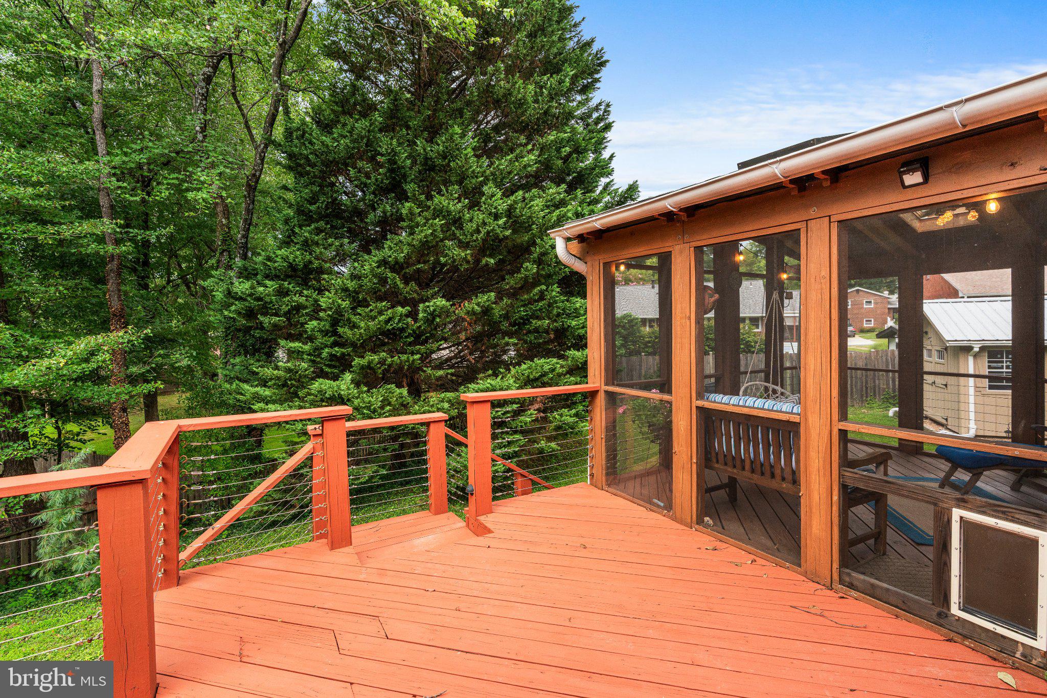 11526 Colt Terrace Silver Spring, MD 20902 - Photo 14 of 37 Serene deck nestled in lush greenery.