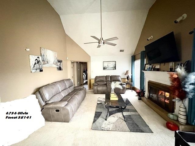 6736 Olivia Forest Road Memphis, TN 38141 - Photo 11 of 18 a living room with furniture a flat screen tv and a fireplace