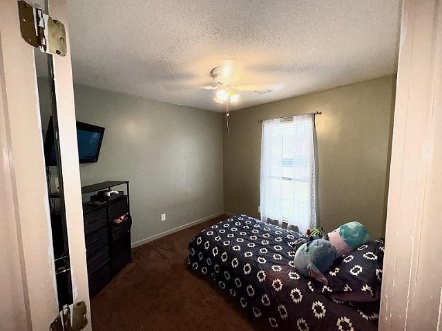 6736 Olivia Forest Road Memphis, TN 38141 - Photo 13 of 18 a bedroom with a bed and a chandelier