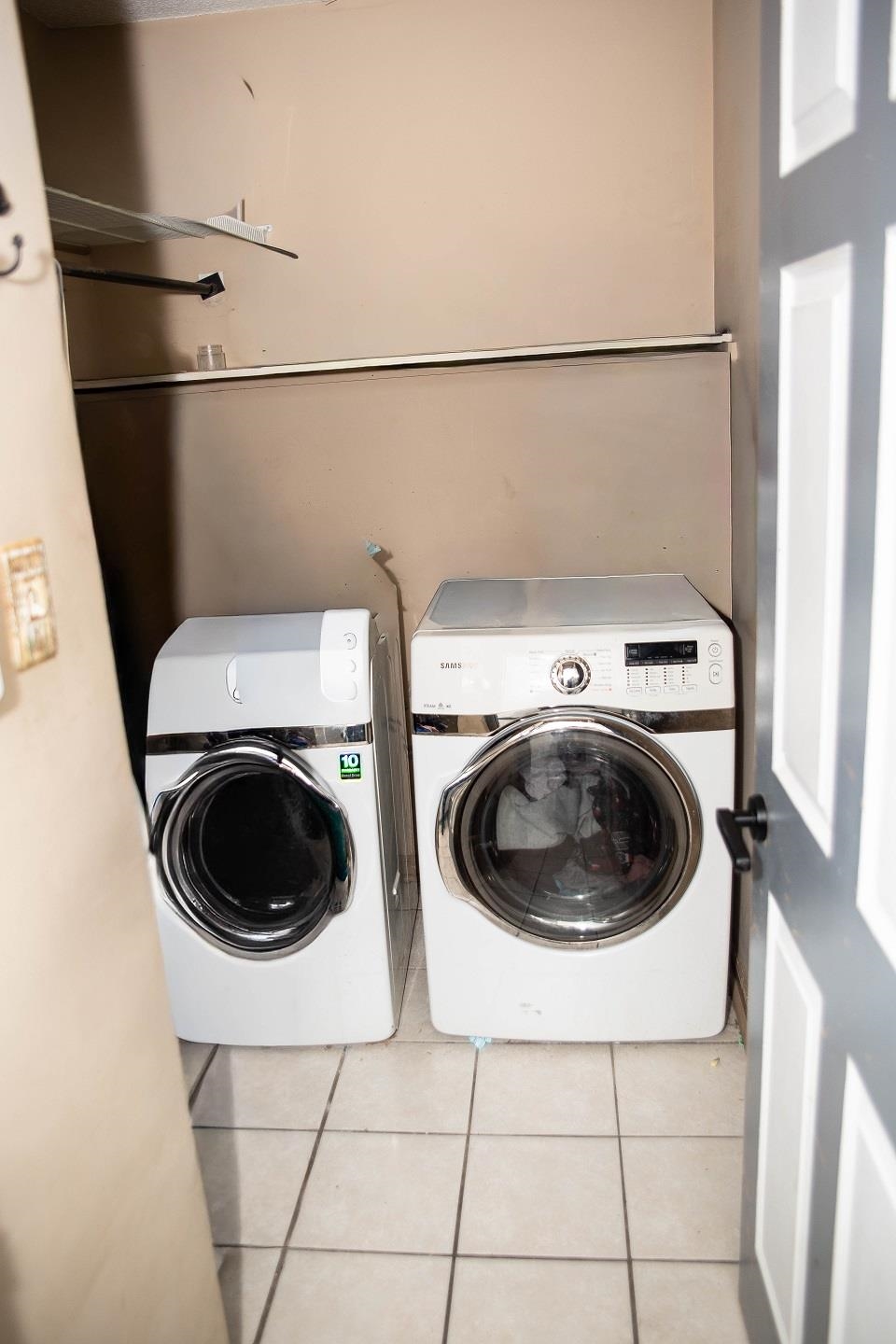 6736 Olivia Forest Road Memphis, TN 38141 - Photo 14 of 18 a utility room with dryer and washer