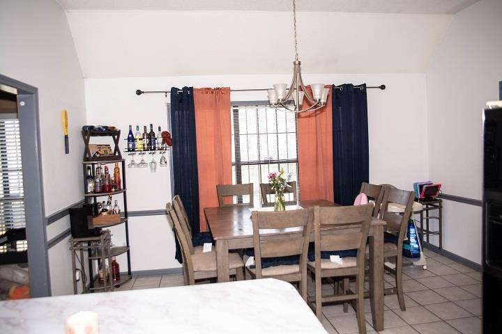 6736 Olivia Forest Road Memphis, TN 38141 - Photo 17 of 18 a dining room with furniture window and wooden floor