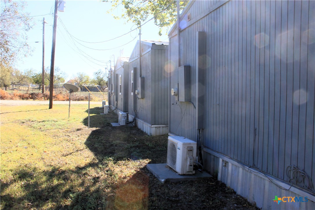 301 Cedar Street, Unit A Lometa, TX 76853 - Photo 7 of 13 a view of a pathway with a wooden fence