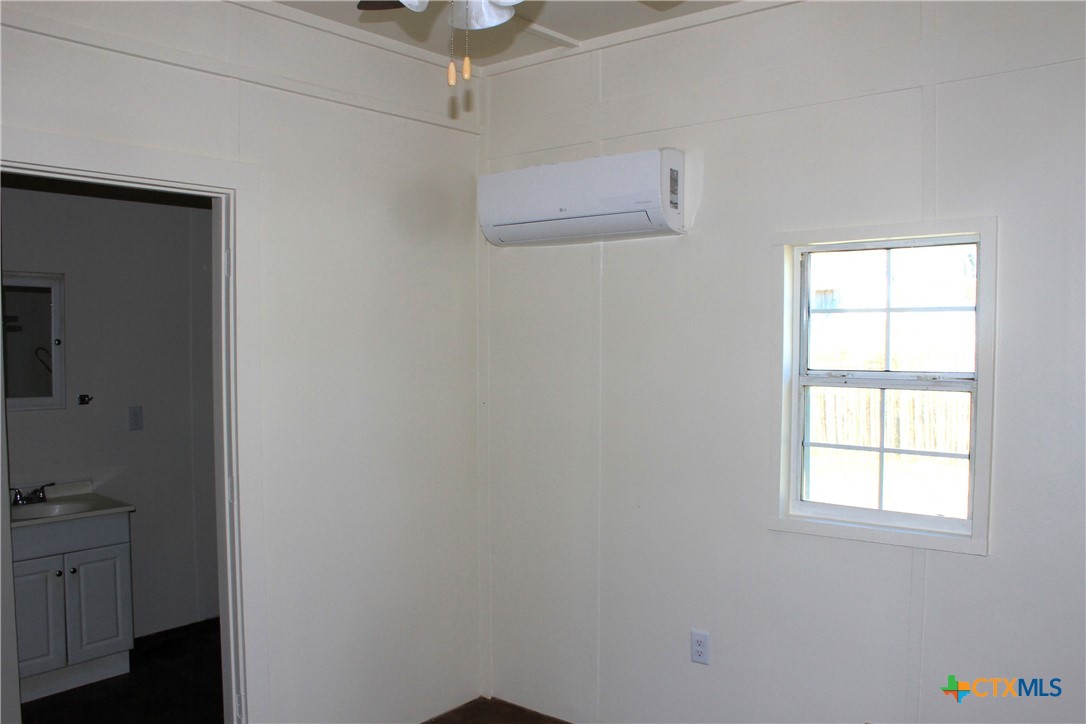 301 Cedar Street, Unit A Lometa, TX 76853 - Photo 8 of 13 an empty room with a window