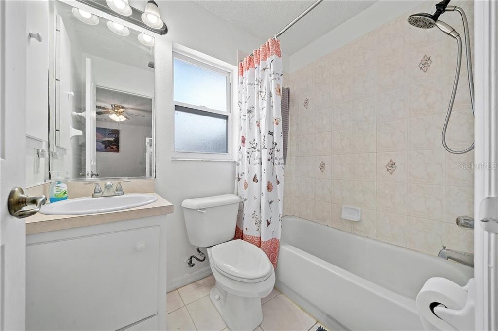 4721 Southwest 142nd Place Road Ocala, FL 34473 - Photo 15 of 25 a bathroom with a sink toilet and shower