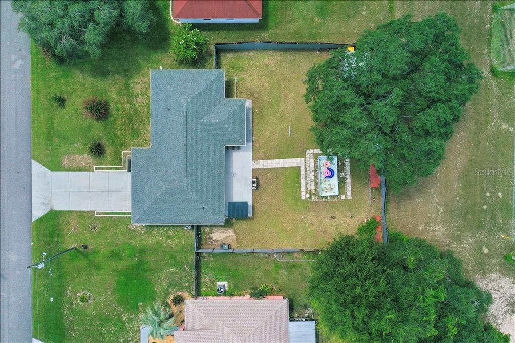 4721 Southwest 142nd Place Road Ocala, FL 34473 - Photo 3 of 25 an aerial view of residential house with outdoor space and trees all around