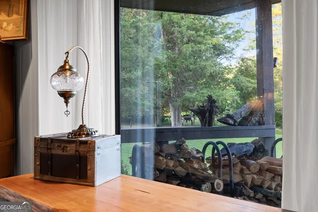 a bathroom with a toilet sink double vanity and mirror