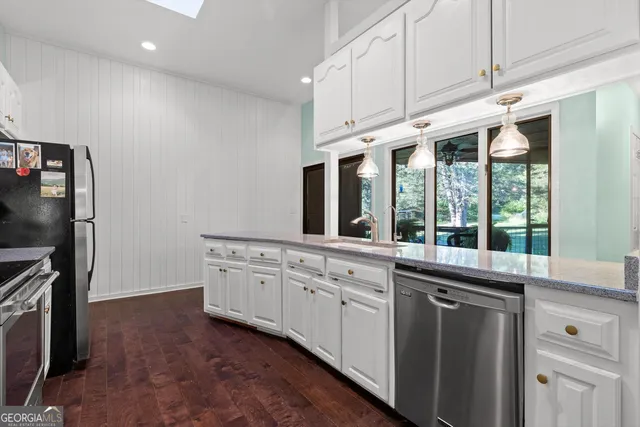 a view of a city with lush green forest