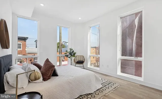 a bedroom with furniture and a window