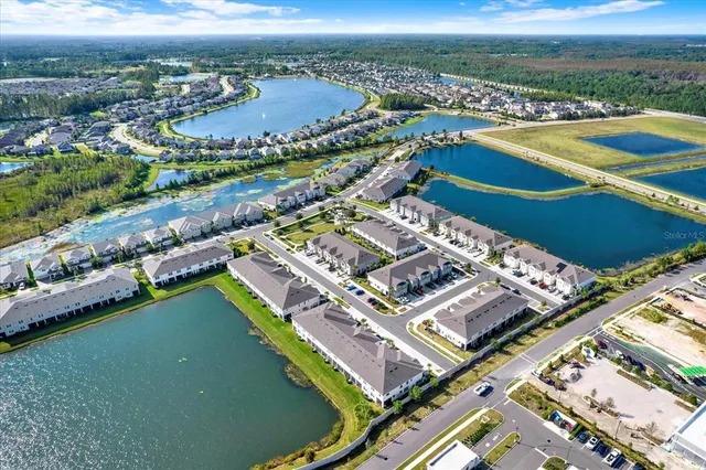 an aerial view of a city with lawn chairs