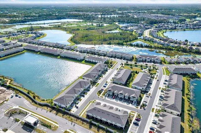 an aerial view of a city with lake