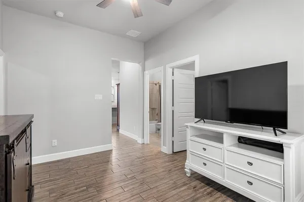 a room with furniture and flat screen tv