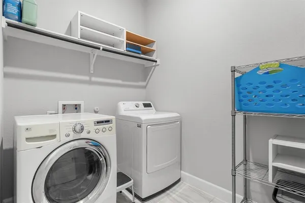 a utility room with dryer and washer