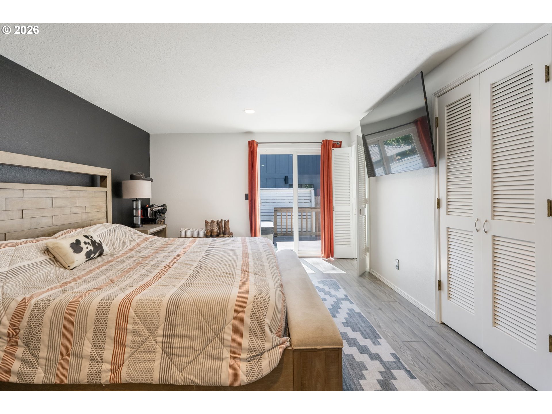 14877 Southwest Oregon Trail Lane Beaverton, OR 97006 - Photo 14 of 41 a bedroom with a bed and a window