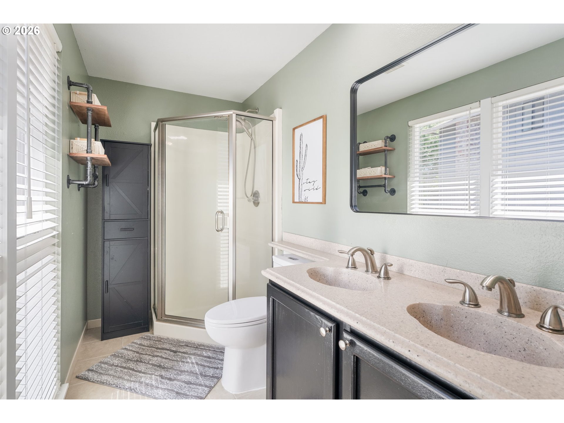 14877 Southwest Oregon Trail Lane Beaverton, OR 97006 - Photo 17 of 41 a bathroom with a sink and a mirror
