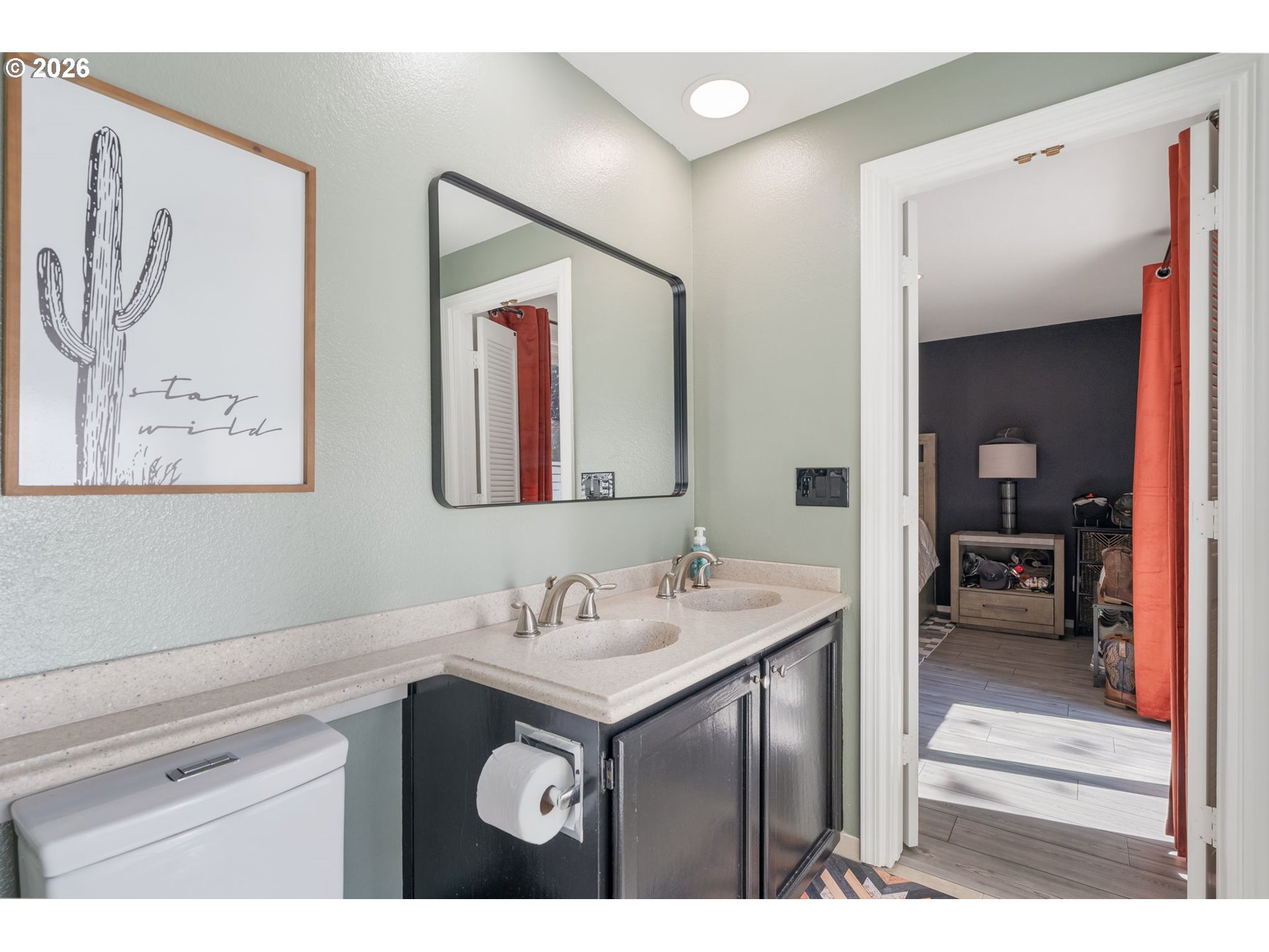 14877 Southwest Oregon Trail Lane Beaverton, OR 97006 - Photo 18 of 41 a bathroom with a sink and a mirror