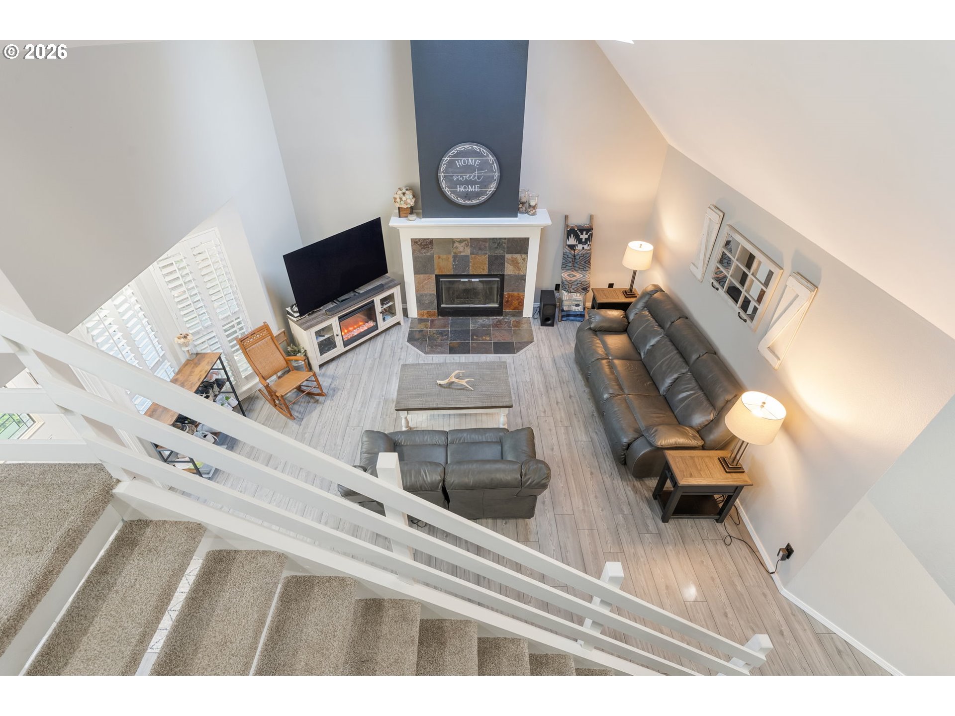 14877 Southwest Oregon Trail Lane Beaverton, OR 97006 - Photo 24 of 41 a living room with furniture and a fireplace