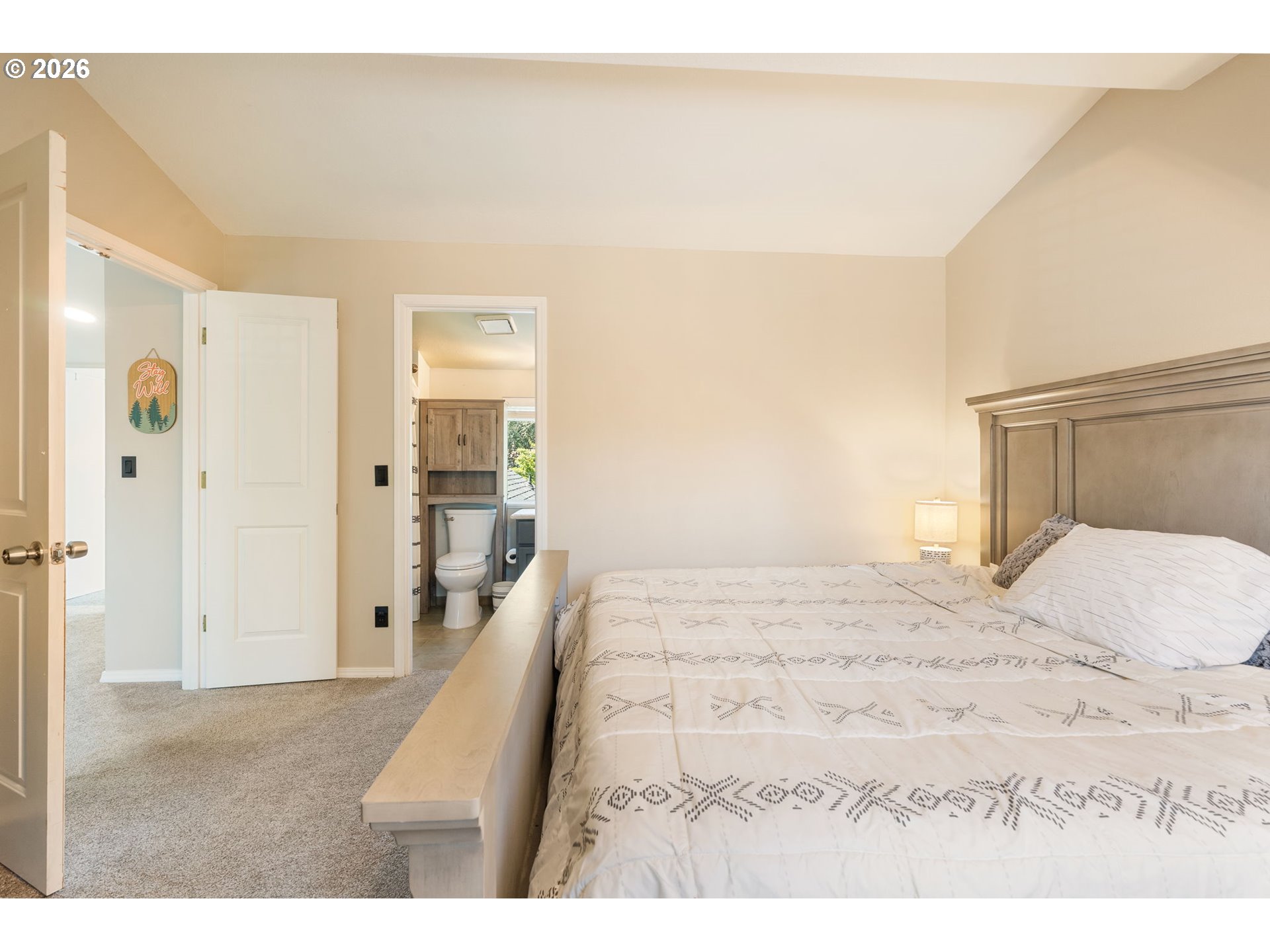 14877 Southwest Oregon Trail Lane Beaverton, OR 97006 - Photo 26 of 41 a bedroom with a bed and a large mirror