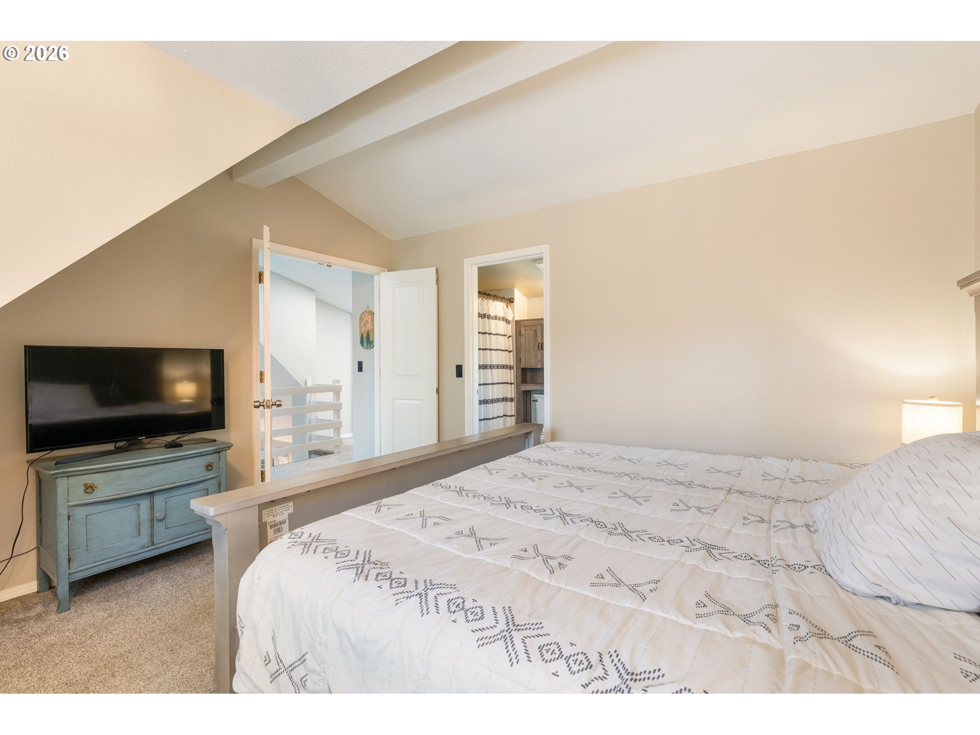14877 Southwest Oregon Trail Lane Beaverton, OR 97006 - Photo 27 of 41 a bedroom with a bed and a flat screen tv