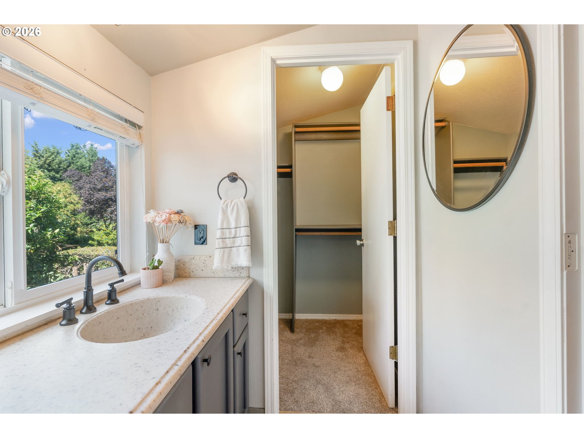 14877 Southwest Oregon Trail Lane Beaverton, OR 97006 - Photo 29 of 41 a bathroom with a sink and a mirror