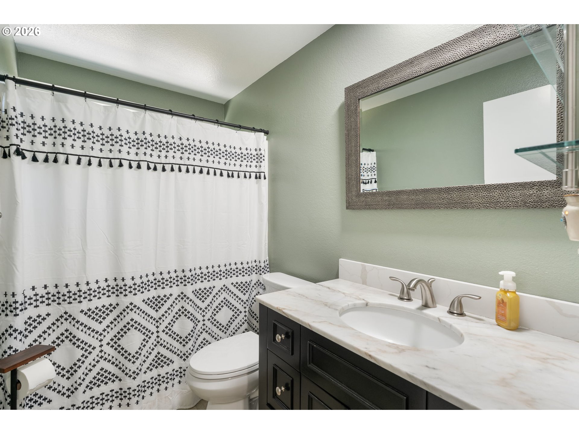 14877 Southwest Oregon Trail Lane Beaverton, OR 97006 - Photo 32 of 41 a bathroom with a sink and a mirror