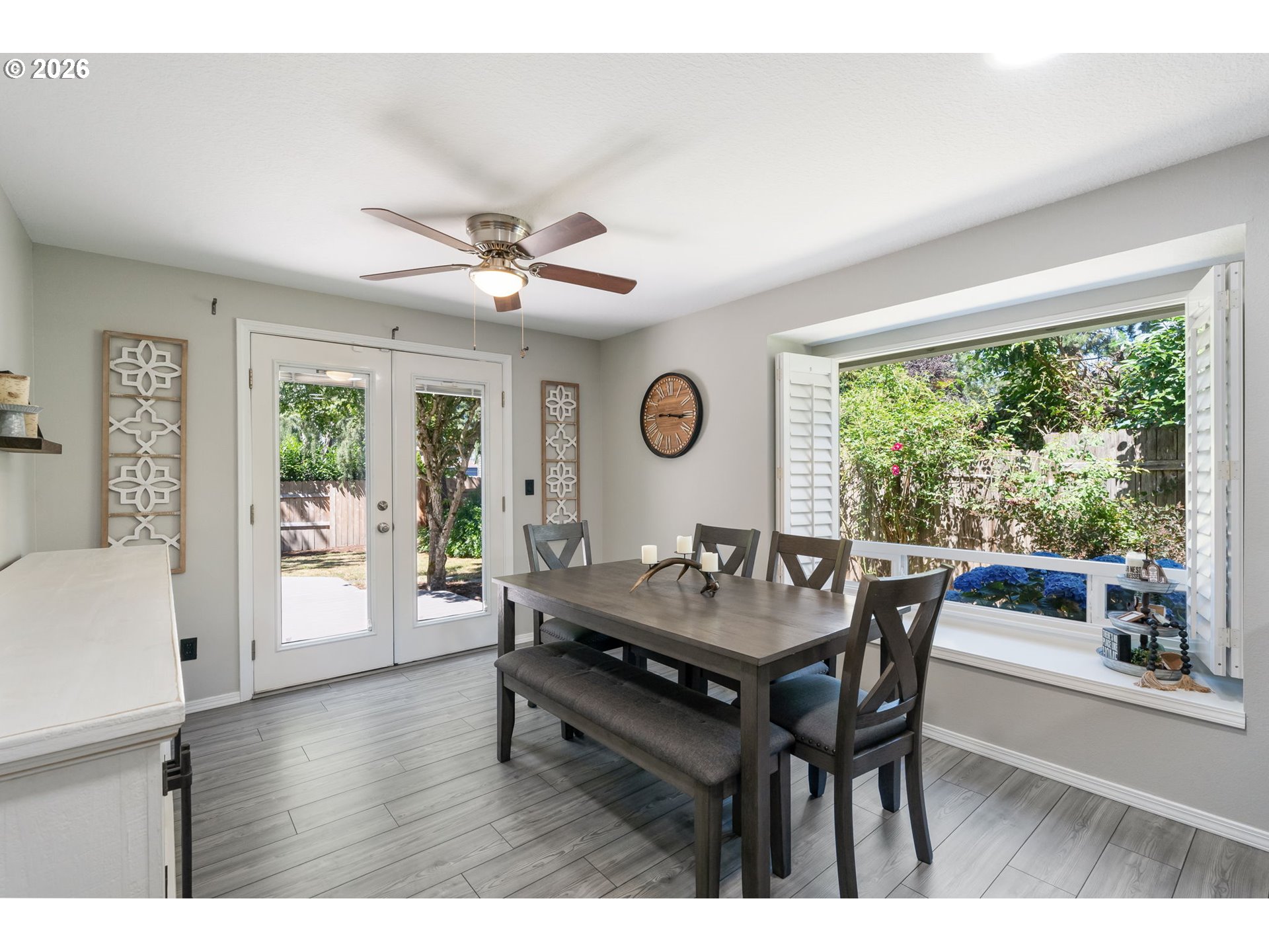 14877 Southwest Oregon Trail Lane Beaverton, OR 97006 - Photo 10 of 41 a dining room with wooden floor and a rug