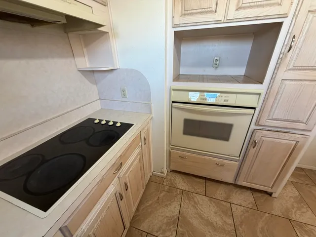 a kitchen with a stove and a microwave
