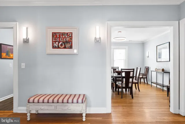 a dining room with furniture and wooden floor