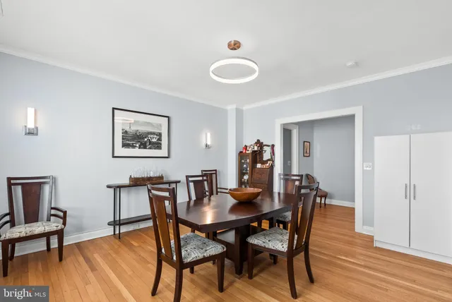 a view of a dining room with furniture and wooden floor