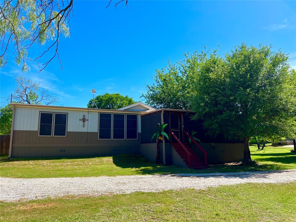 1926 Roadrunner Road Graford, TX 76449 - Photo 3 of 37 Front of the Lakehome with Private Driveway and lots of extra parking for Family & Friends.