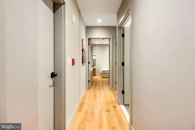a bathroom with a shower and a glass door