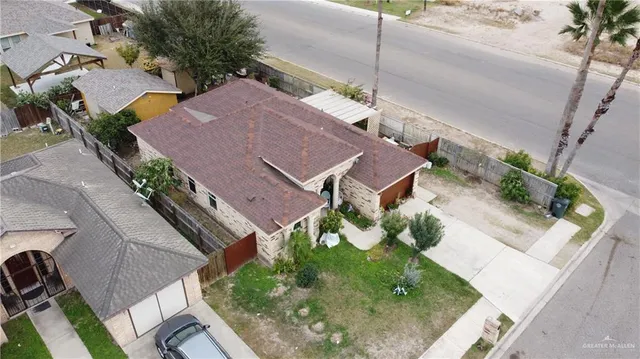 an aerial view of house with yard