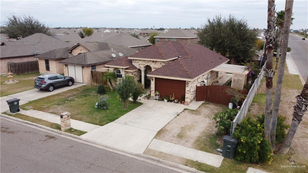 613 South Moorefield Road Mission, TX 78572 - Photo 17 of 19 an aerial view of multiple houses with a yard