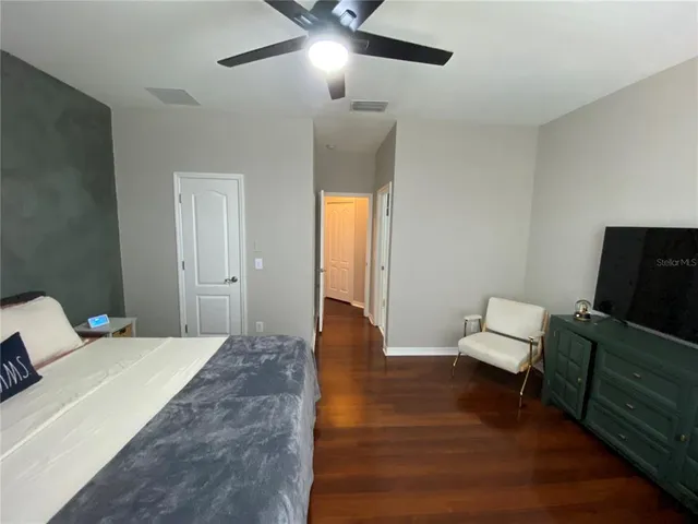 a bedroom with a bed and furniture