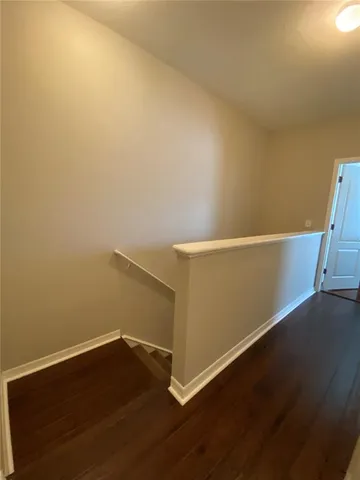 an empty room with wooden floor