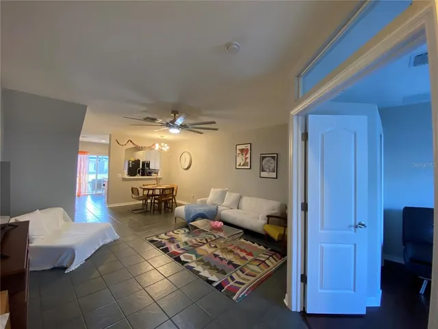 a bedroom with furniture and wooden floor