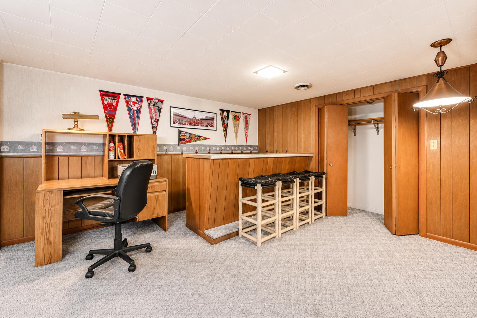 4428 Phoenix Drive Springfield, OH 45503 - Photo 20 of 35 The lower levels adds to the square footage with extended lounging space. Complete with bar and seating, this room can handle gaming, media and plenty of fun!