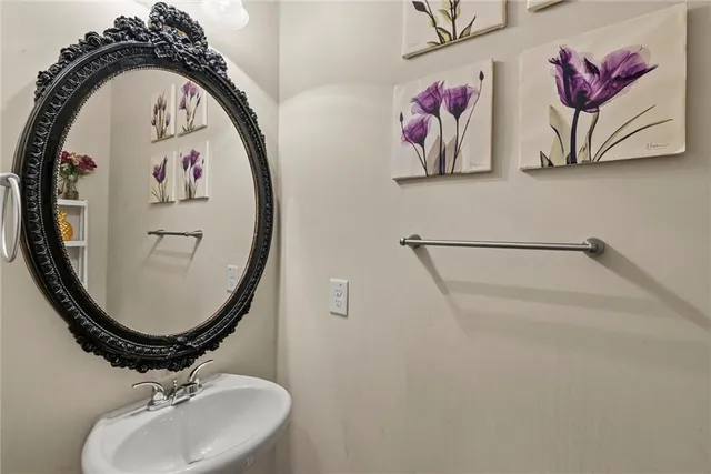 a bathroom with a sink and mirror